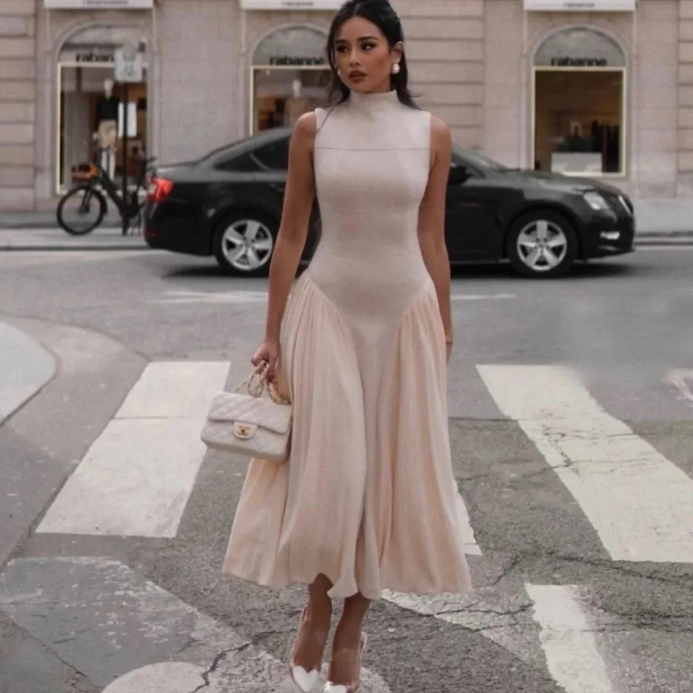 UNIQUE PLEATED PANELED
SLEEVELESS MIDI DRESS